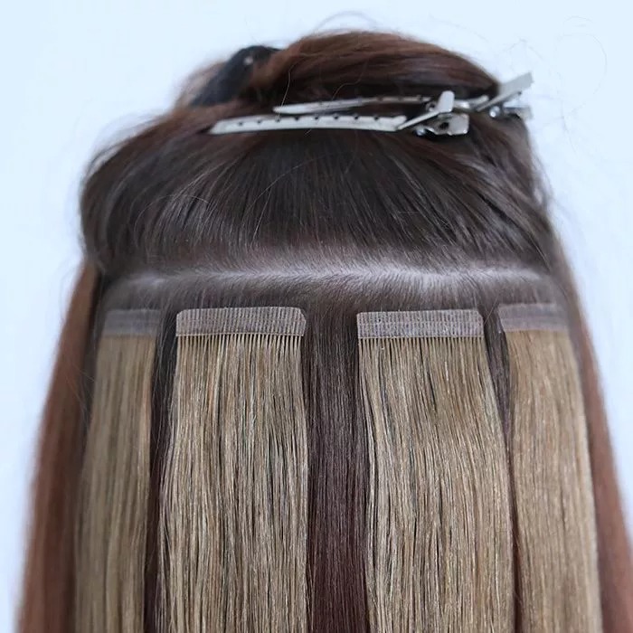 Apply tape-in hair extensions